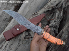 Real Damascus Knife with a beautiful rain drop pattern on the blade, showcasing its craftsmanship and design.
