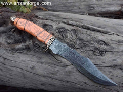 Detailed view of the orange color turquoise stone handle of the Damascus Hunting Knife, showcasing its ergonomic design.