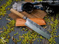 Ansari Forge hand-forged 7-inch Santoku knife with olive wood handle and oak wood sleeve.