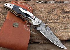 Damascus pocket knife with thumb stud opener & pocket clip.