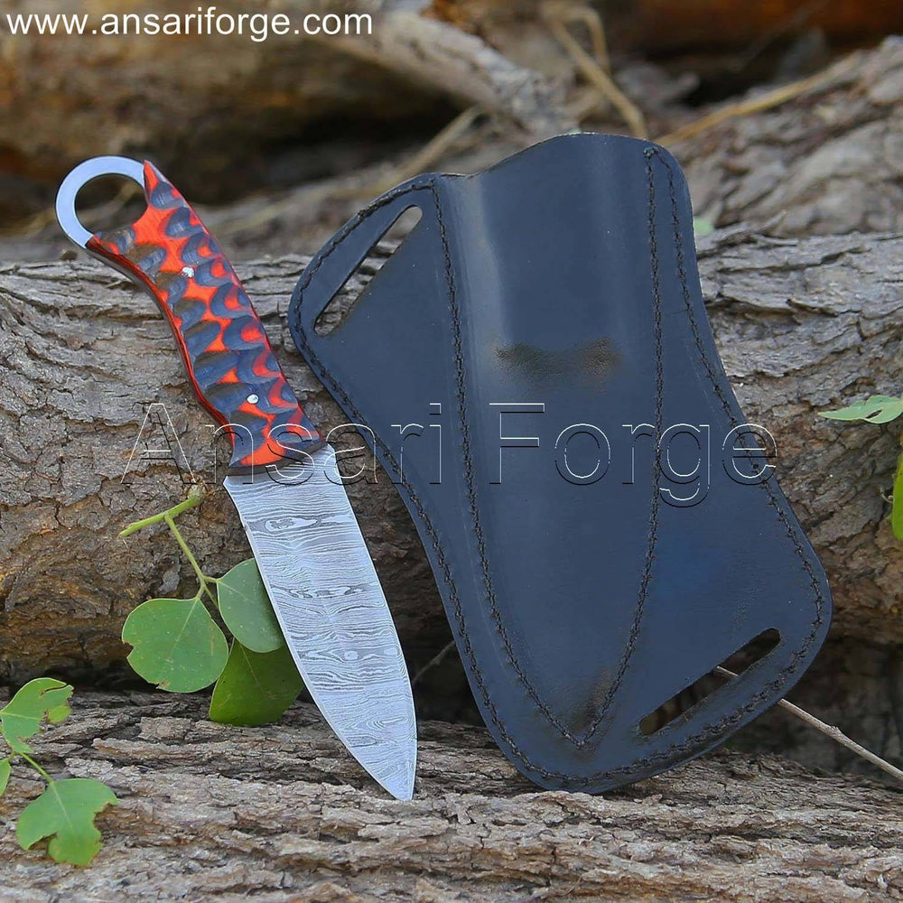 Hand-forged Damascus steel EDC fixed blade knife with Pakkawood handle, displayed in its genuine cowhide cross draw sheath.