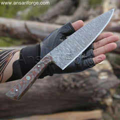 Sharp Damascus chef knife with a ladder pattern, pine cone handle, and leather sheath.