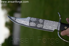 Mosaic Damascus Bowie Knife with beautiful Damascus steel blade pattern, buffalo horn handle, and black leather sheath featuring scrimshaw artwork.