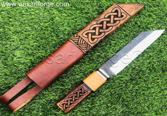 Beagnoth Viking Seax Knife on grass, showing the full knife and sheath.