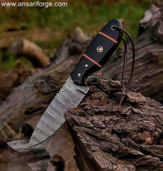 Damascus steel hunting knife with buffalo horn handle, perfect for outdoor adventures.