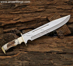 15 inch custom stag handle bowie knife with leather sheath. D2 steel clip point blade, full tang construction for strength. Handmade with brass guard, ideal for hunting, camping, or collection.