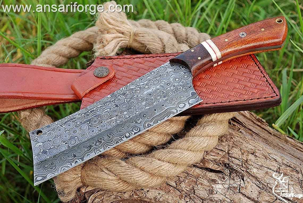 Custom handmade Damascus steel cleaver chopper chef knife Damascus steel 1095 & 15n20 hand forged rain drop pattern cleaver blade with 58 - 60 HRC hardness . Rosewood handle and bolsters . Comes with genuine cowhide leather sheath
