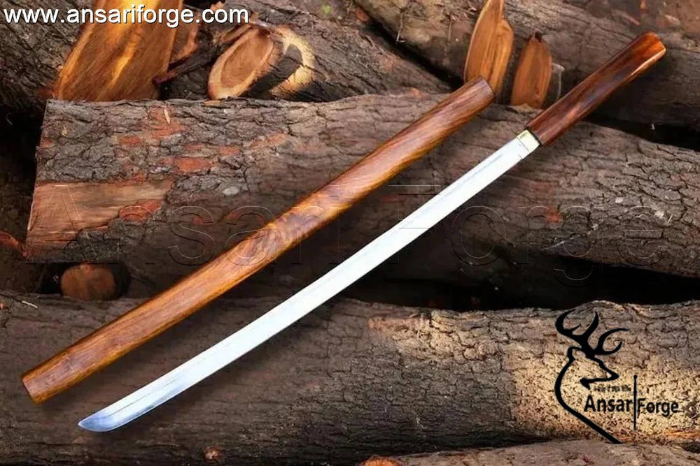 Close-up of mirror polished 5160 High Carbon Steel tanto blade with single bevel.