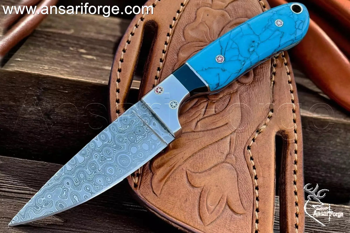 Ansari Forge Handmade Cowboy Knife with raindrop Damascus steel blade and leather sheath.
