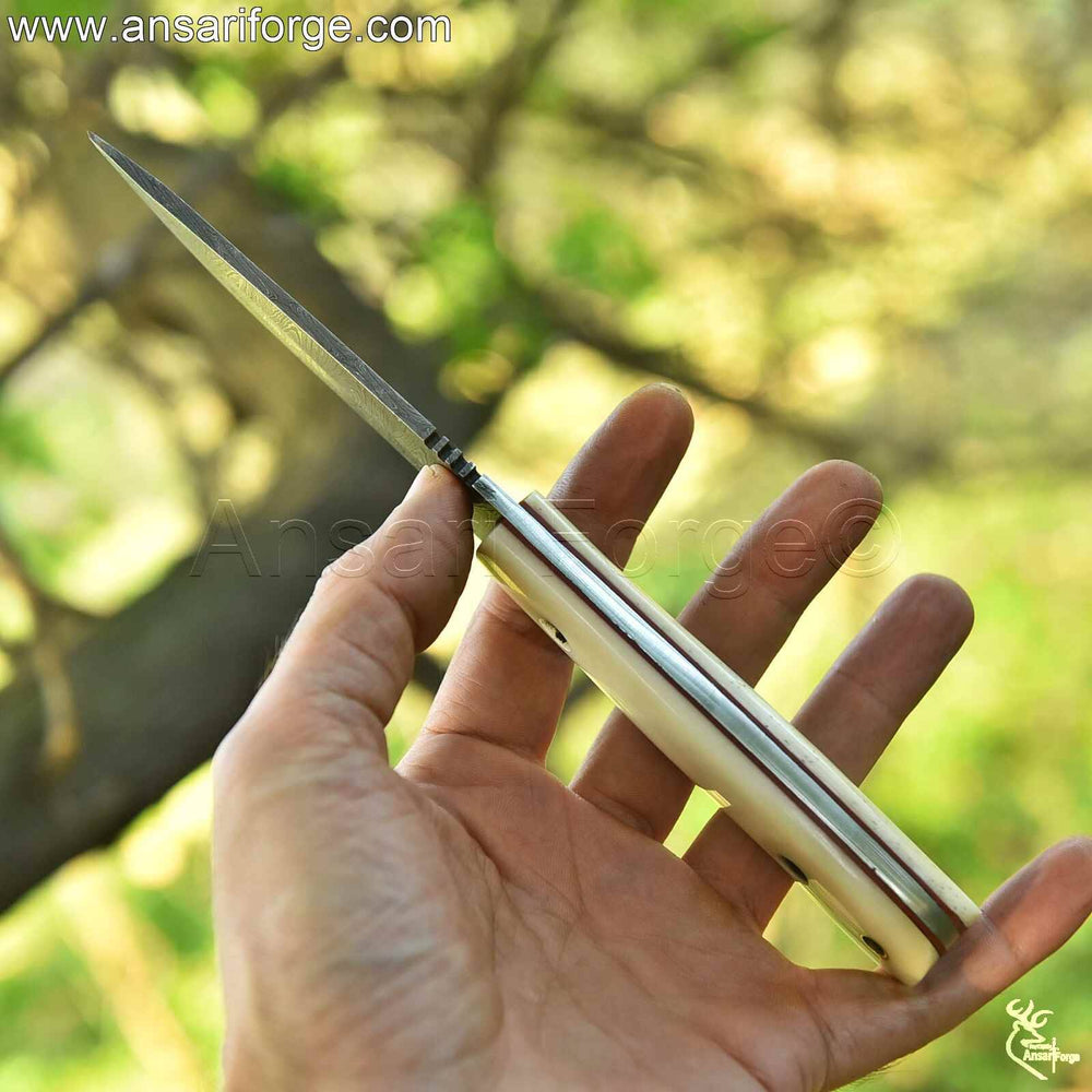 Natural camel bone knife handle with ergonomic grip - durable and comfortable design.