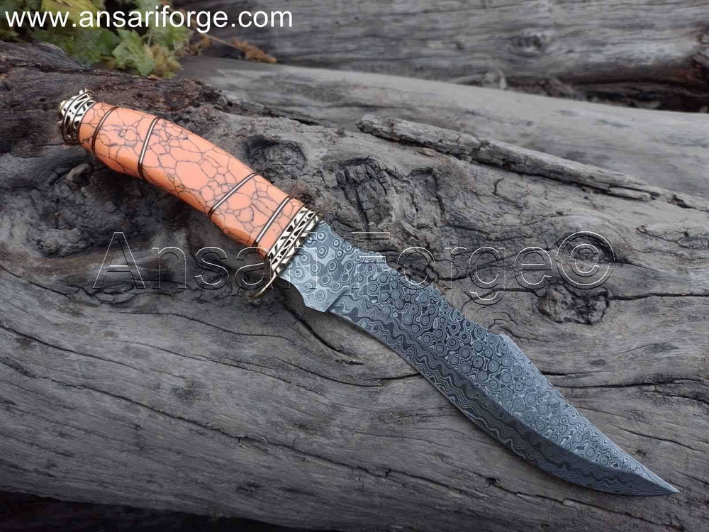 Detailed view of the orange color turquoise stone handle of the Damascus Hunting Knife, showcasing its ergonomic design.