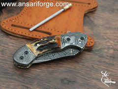Closed Cowboy Pocket Knife showing Damascus Steel Bolsters and Brass File Work.