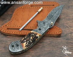 Closed Cowboy Pocket Knife showing Damascus Steel Bolsters and Brass File Work.