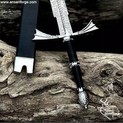 Detail of the Zinc Alloy pommel with beautiful art work and the wings-type hand guard on the Dark Sister Medieval sword.