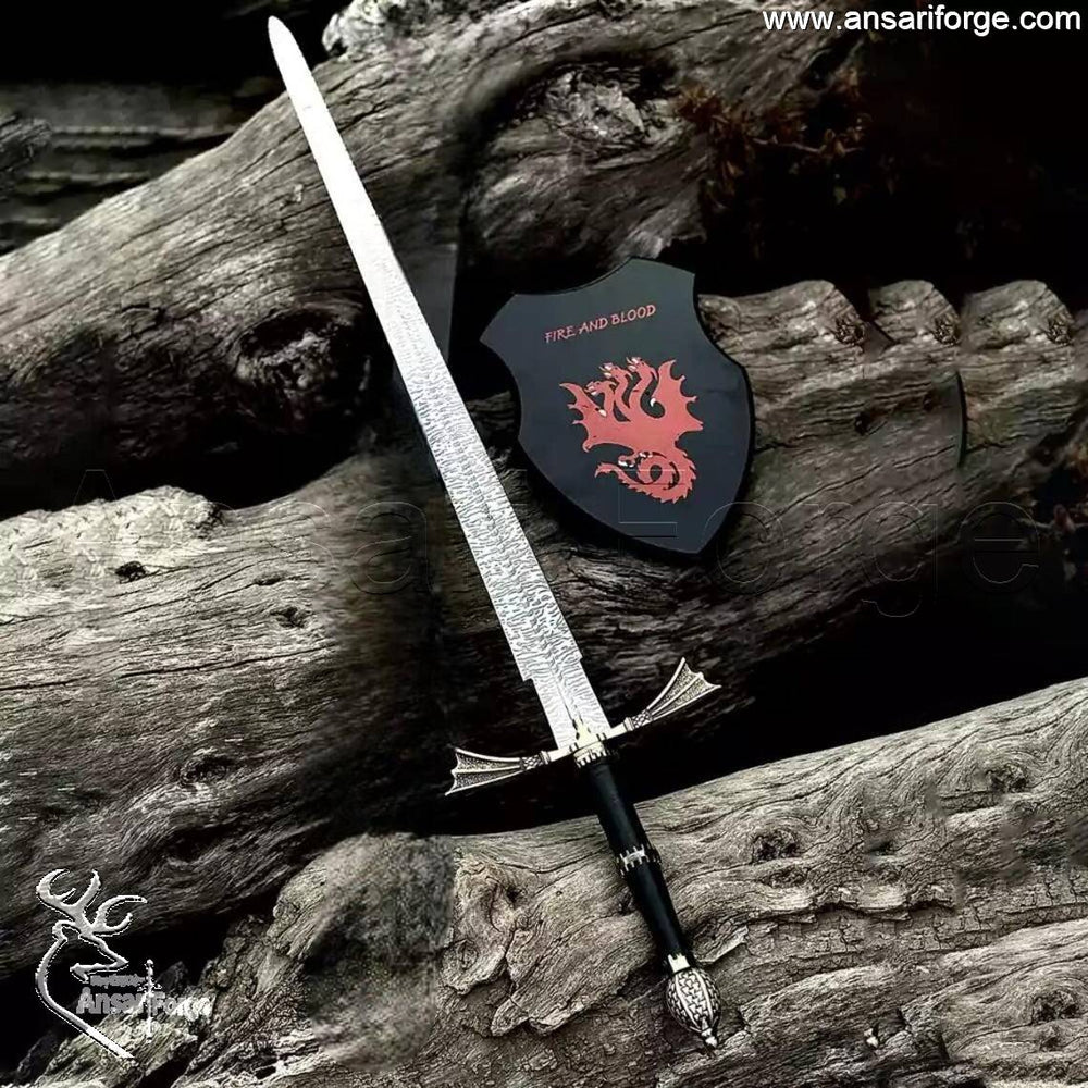 Studio shot of the Dark Sister sword replica held by a collector, emphasizing its size and 56 HRC hardness.