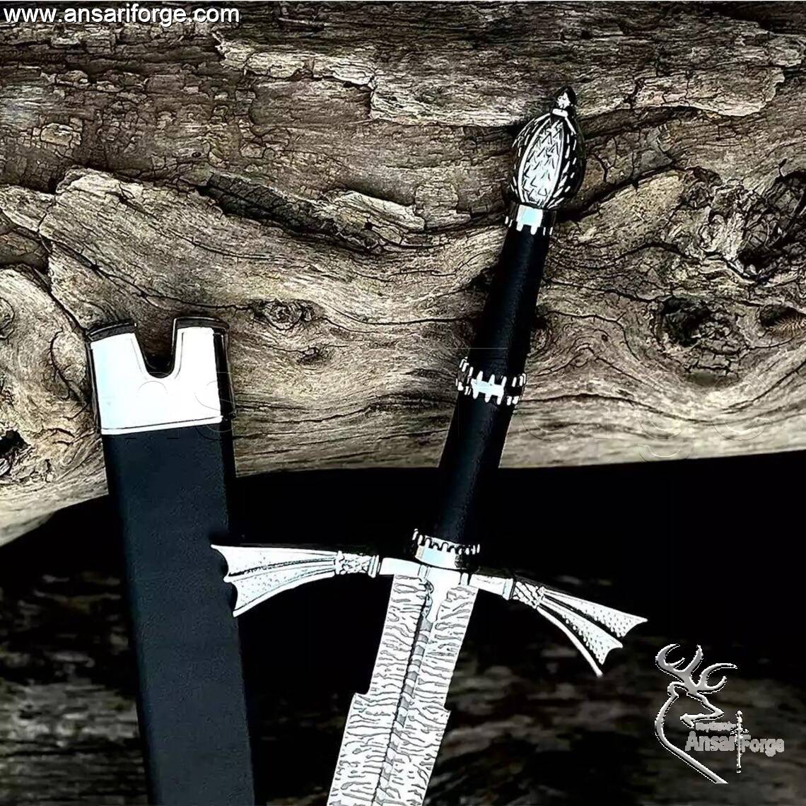 Detail of the Zinc Alloy pommel with beautiful art work and the wings-type hand guard on the Dark Sister Medieval sword.