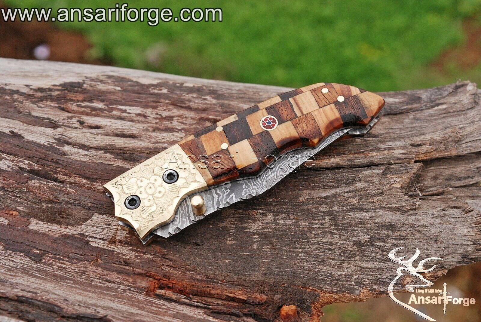Damascus folding knife with twist pattern blade and Rosewood handle.