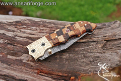 Damascus folding knife with twist pattern blade and Rosewood handle.