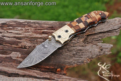 Handmade Damascus folding knife with twist pattern blade and Rosewood handle.