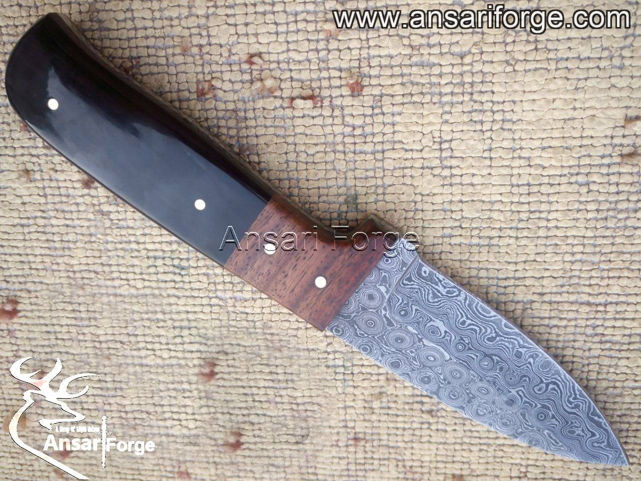 Handmade Damascus Steel Hunting Knife - Black Eagle X with raindrop pattern blade and water buffalo horn handle.