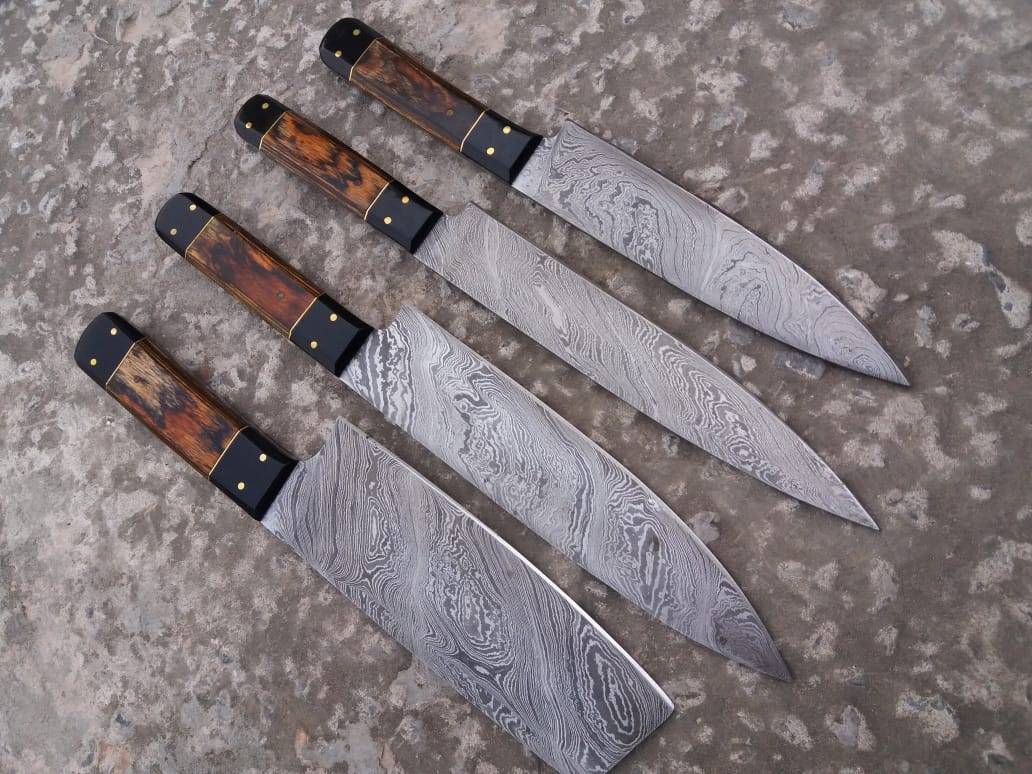 Close-up of a chef knife set blade, highlighting the twist pattern of 1095 high carbon & 15n20 nickel Damascus steel.