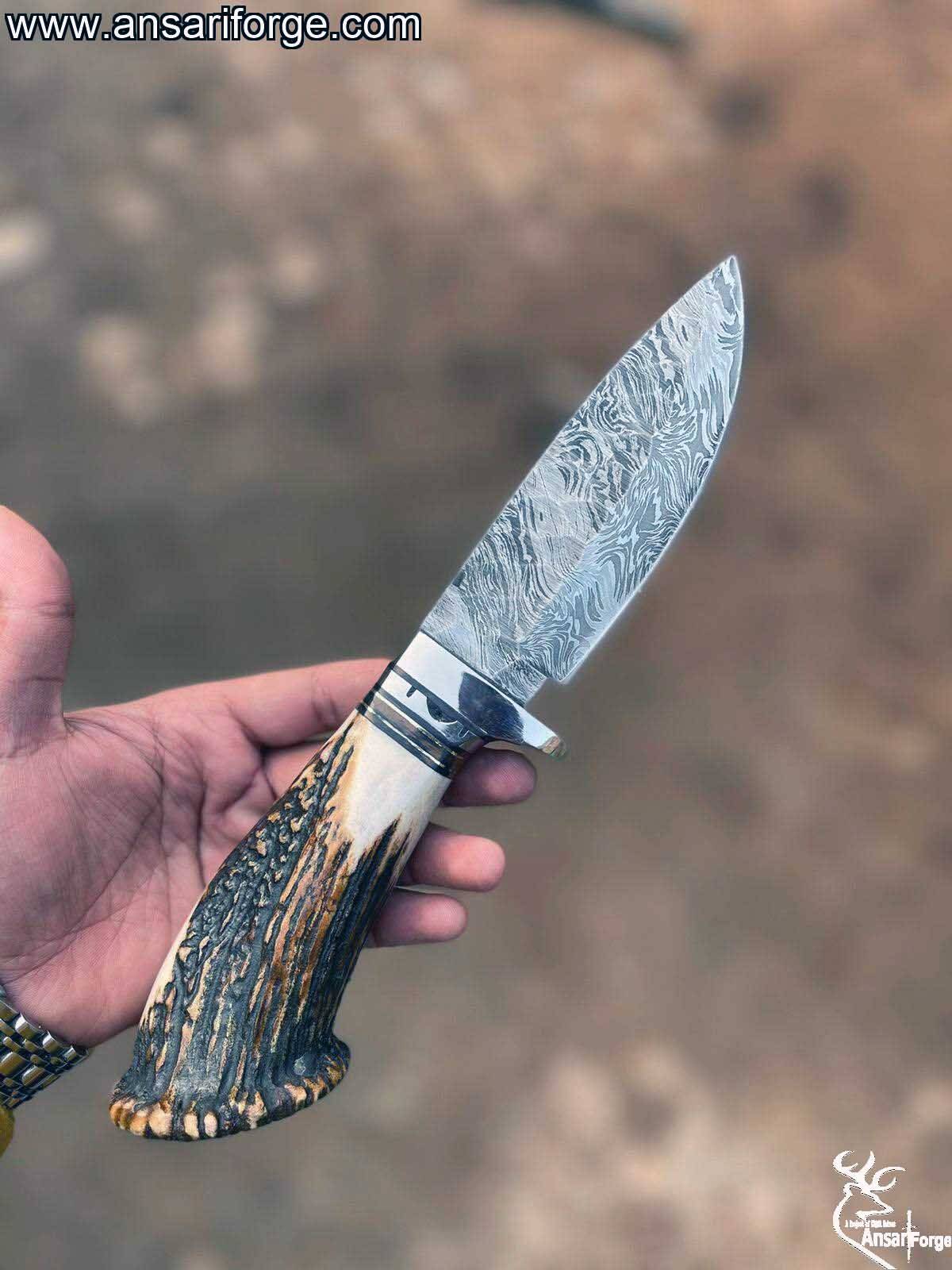 Close-up of Handmade Damascus Hunting Knife with Twist Pattern.
