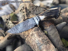Custom Damascus hunting knife with stag handle.