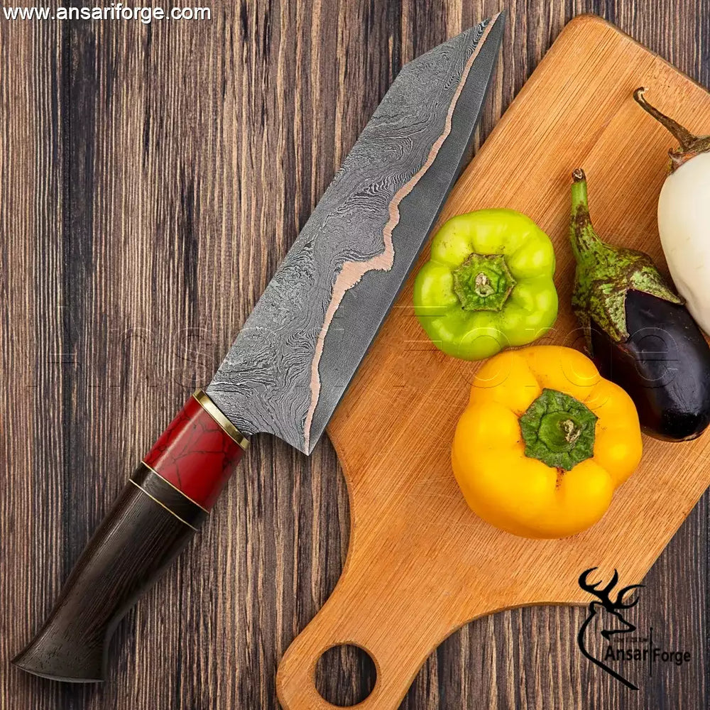 Damascus steel chef knife with copper blade and leather sheath.