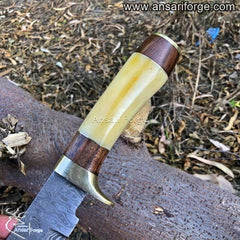 Camel bone handle of handmade Damascus steel knife.