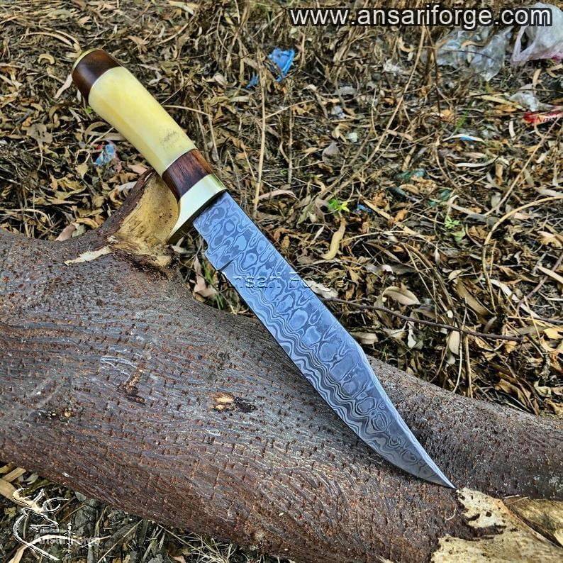 Damascus steel handmade knife showcasing beautiful ladder pattern.