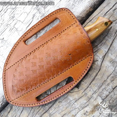Damascus steel EDC knife securely housed in a hand-stitched genuine cowhide leather cross draw sheath.