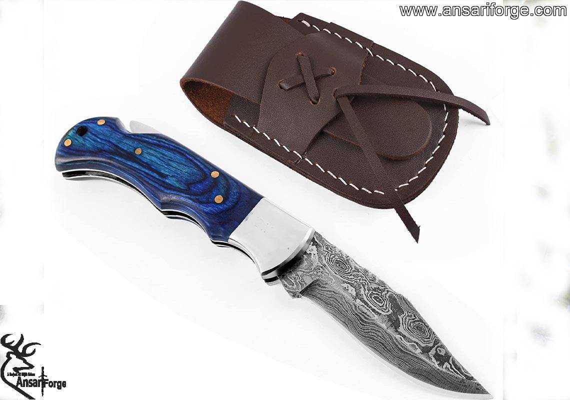 Handmade Damascus Pocket Knife with blue Pakka wood handle and genuine cowhide leather sheath.