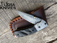 Close-up of the Damascus steel blade with intricate Fire pattern on a handmade folding pocket knife.