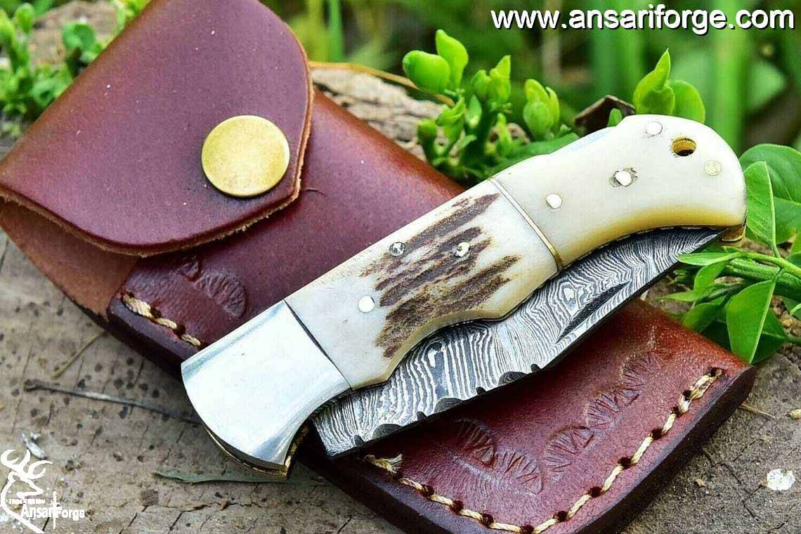 Handmade leather sheath for a Damascus pocket knife.