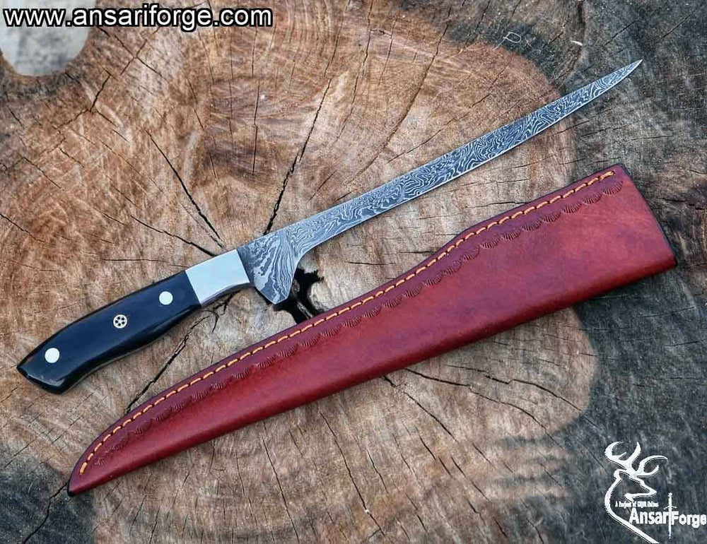 Hand-forged Damascus steel fish fillet knife with water buffalo horn handle.