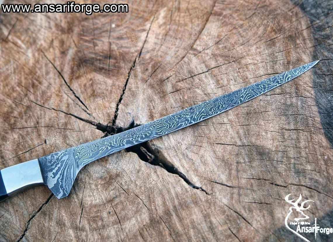 Close-up of Ansari Forge handmade Damascus knife showing fire pattern blade design.