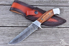 Hand-forged Damascus steel hunting knife with walnut wood handle and cowhide leather sheath.