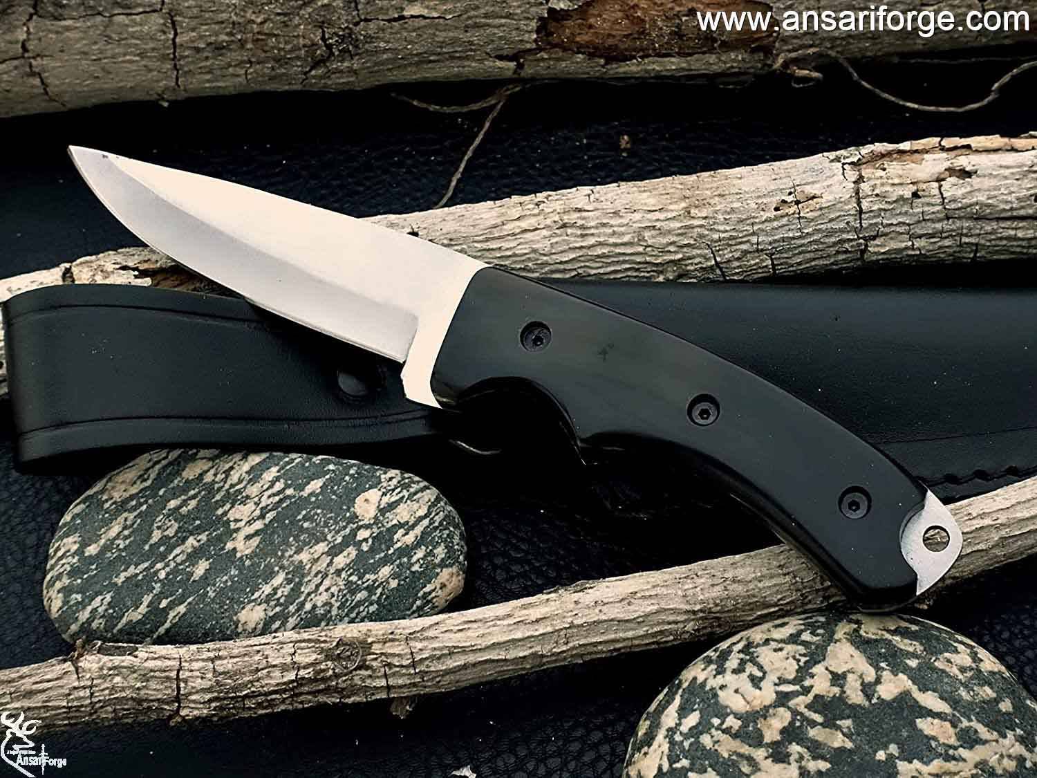 Full Tang Hunting Knife by Ansari Forge featuring a hand-forged D2 tool steel blade with a drop point design, buffalo horn handle, and black leather sheath.