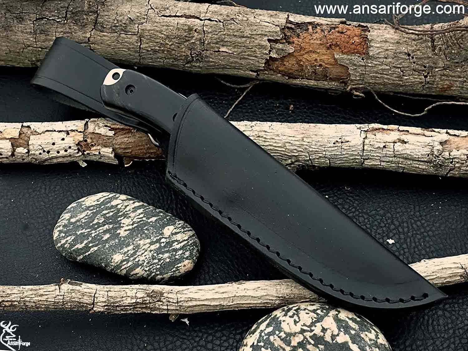 Full Tang Hunting Knife by Ansari Forge featuring a hand-forged D2 tool steel blade with a drop point design, buffalo horn handle, and black leather sheath.