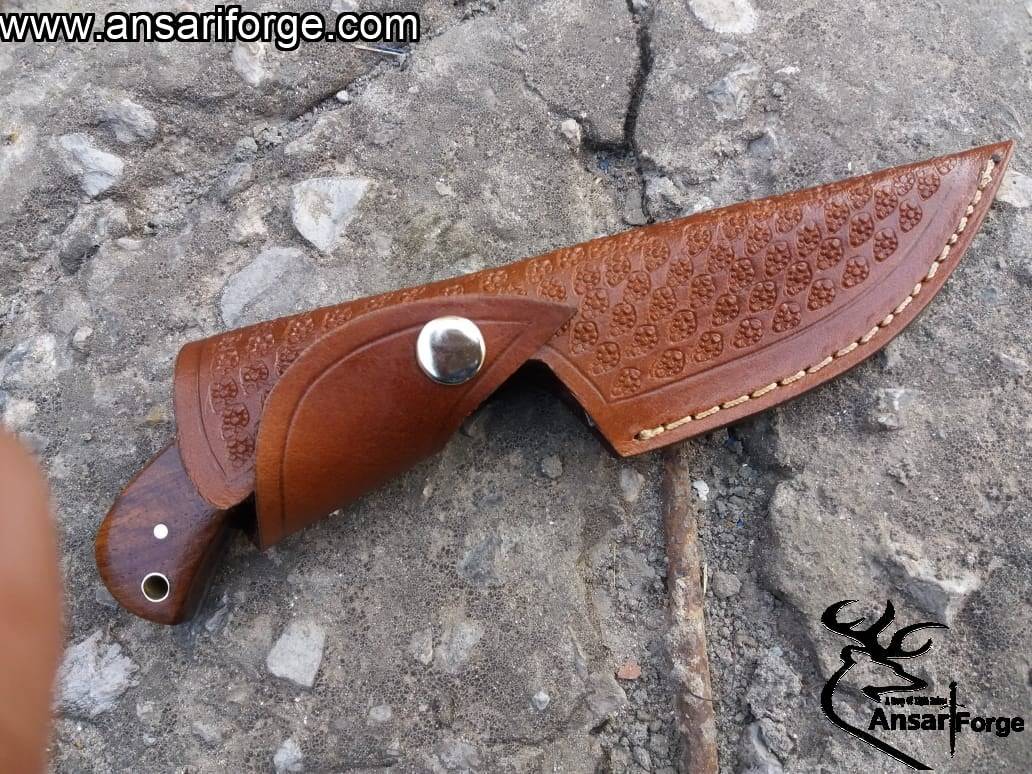 Premium Damascus Hunting Skinning Knife in a handmade leather sheath.
