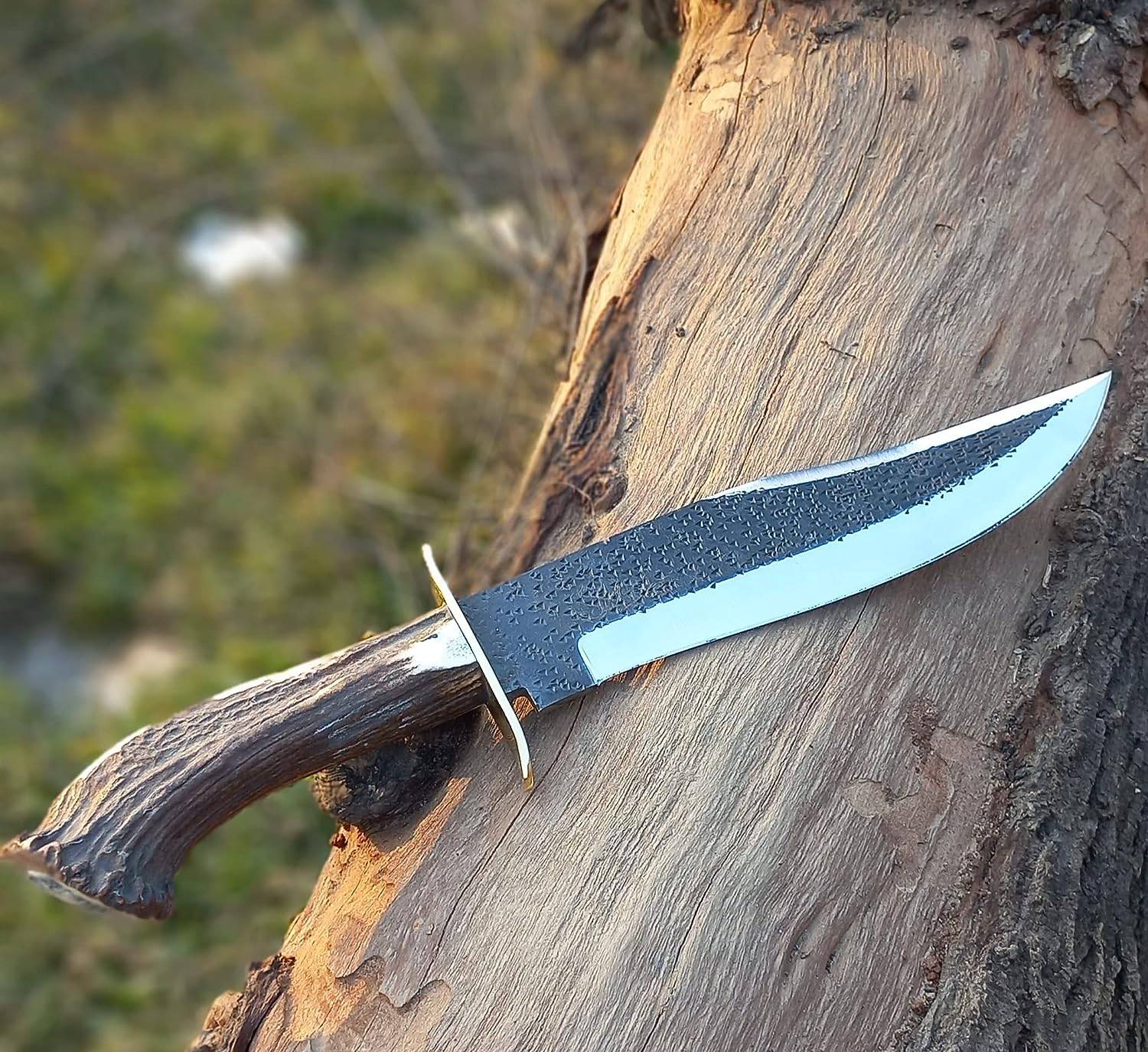 Hand-forged 13-inch Bowie knife with 8-inch clip point blade and stag antler handle.