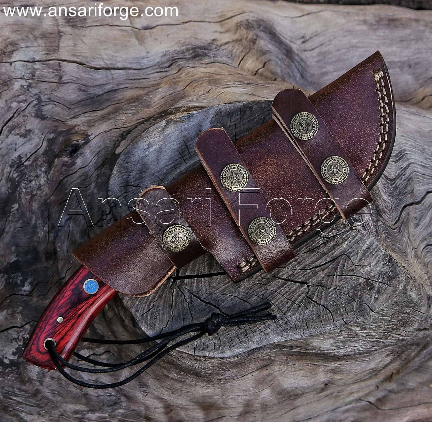 Damascus Gut Hook Knife secured in a brown cowhide leather horizontal sheath.