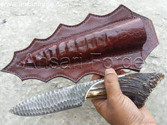 Stag Antler handle knife with black D2 knapped steel blade in brown leather sheath.
