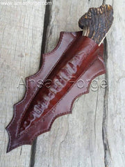 Stag Antler handle knife with black D2 knapped steel blade in brown leather sheath.
