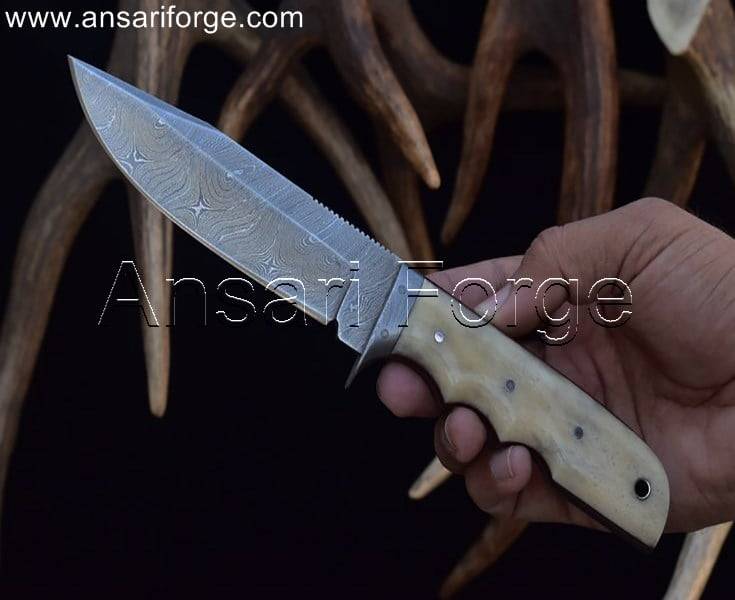 Damascus hunting knife with camel bone handle and leather sheath.