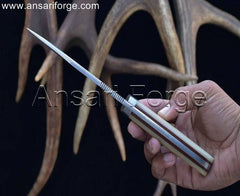Razor-sharp Damascus steel hunting knife for effortless control, featuring a comfortable camel bone handle and secure leather sheath.