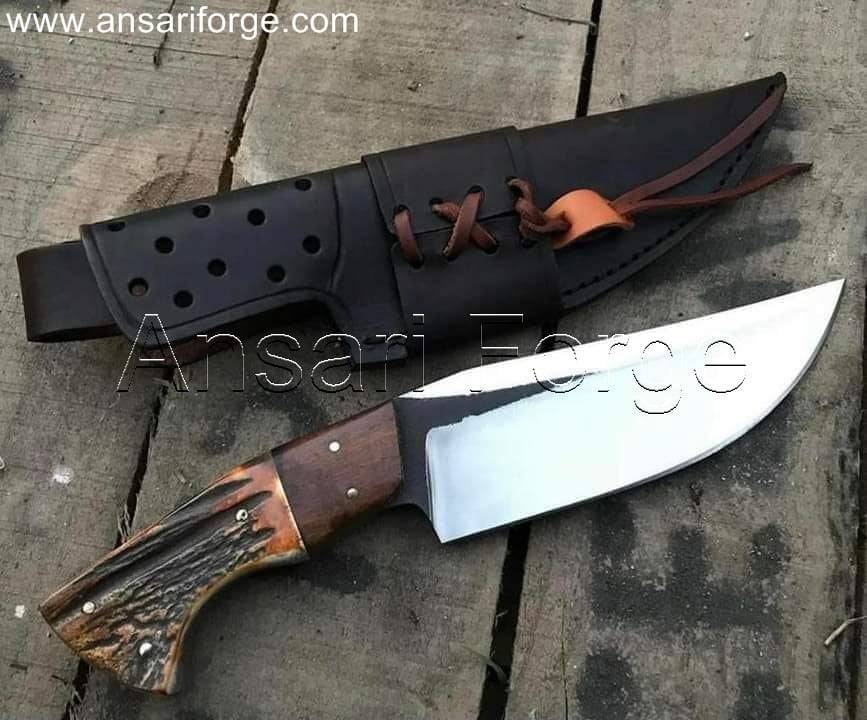 Stag handle hunting knife with leather sheath.
