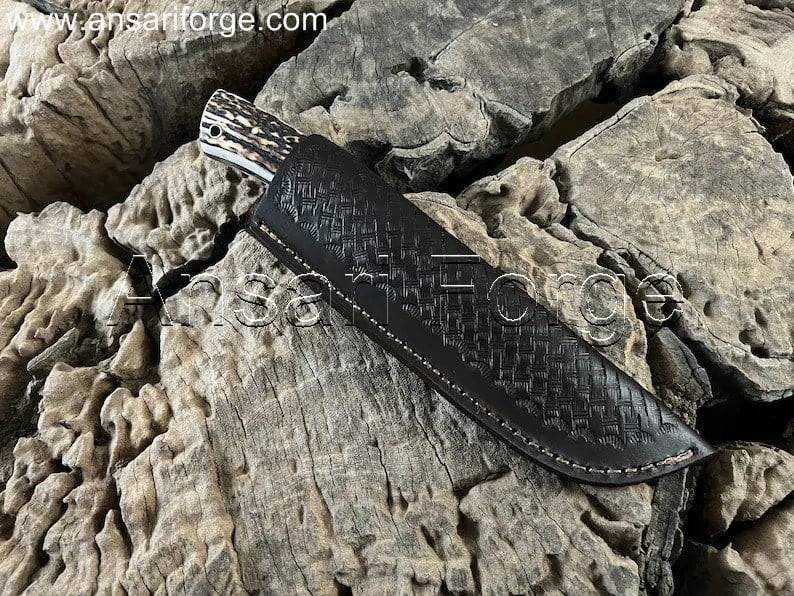 Damascus Knife with Stag Antler Handle - Exquisite blade with 512-layer twist pattern, comfortable handle, and leather sheath.