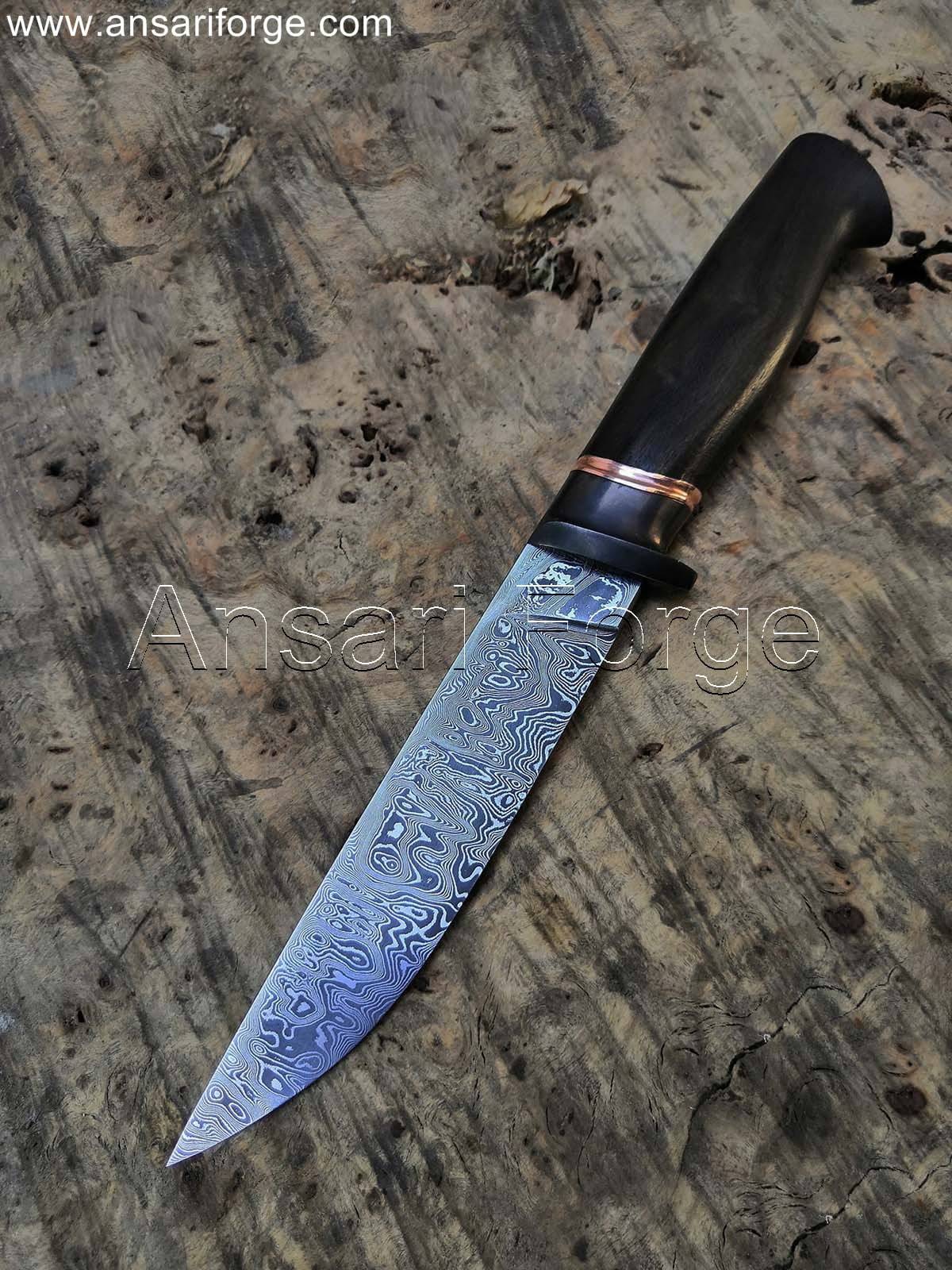 Munin Viking Knife: Hand-forged Damascus steel blade with ebony wood handle and leather sheath.