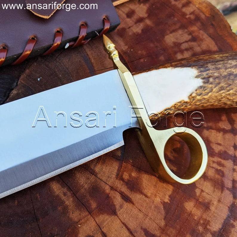 Detailed view of the Tombstone Bowie Knife's stag antler handle with brass ring guard.